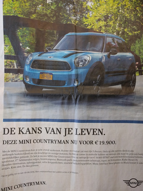 Mini Cooper in Vlaamse krant met nummerplaat uit NYC