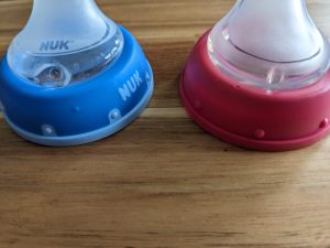 Blue Nuk Spout for sippy cup and pink non-name brand spout for comparison